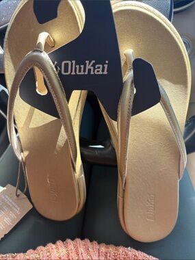 OluKai Metallic Gold Leather Thong Sandals